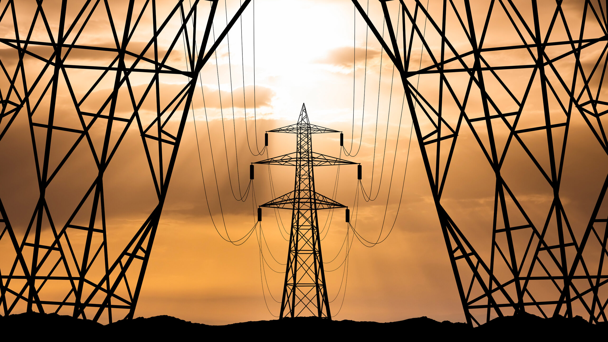 High voltage towers at sunset background. Power lines against the sky