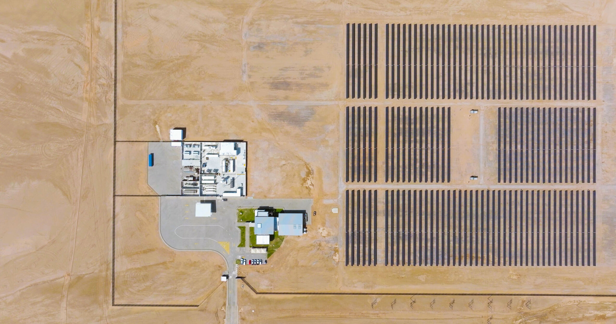 aerial view of a solar array and facility