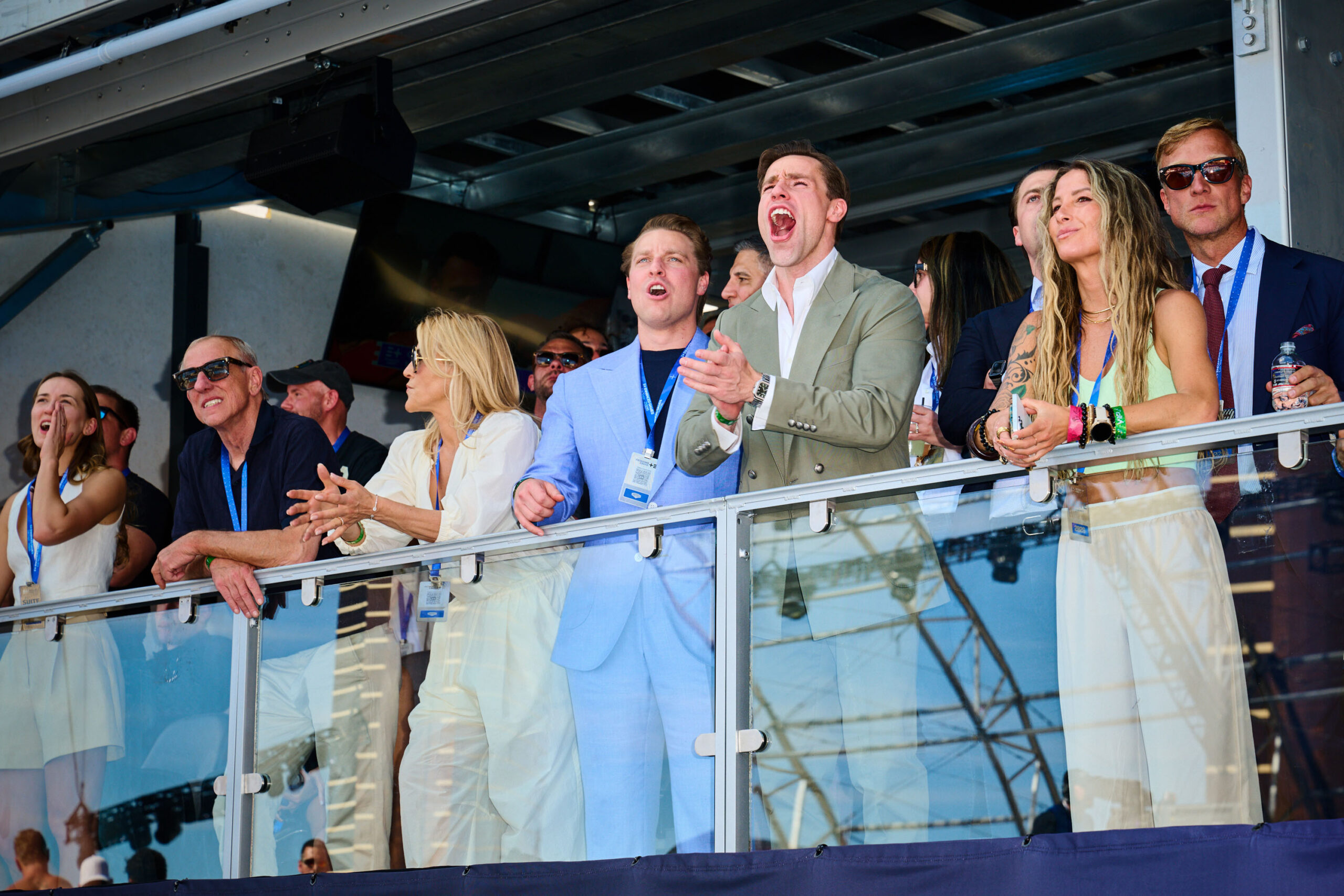 Max Martin with his mouth open wide to cheer from the VIP stands