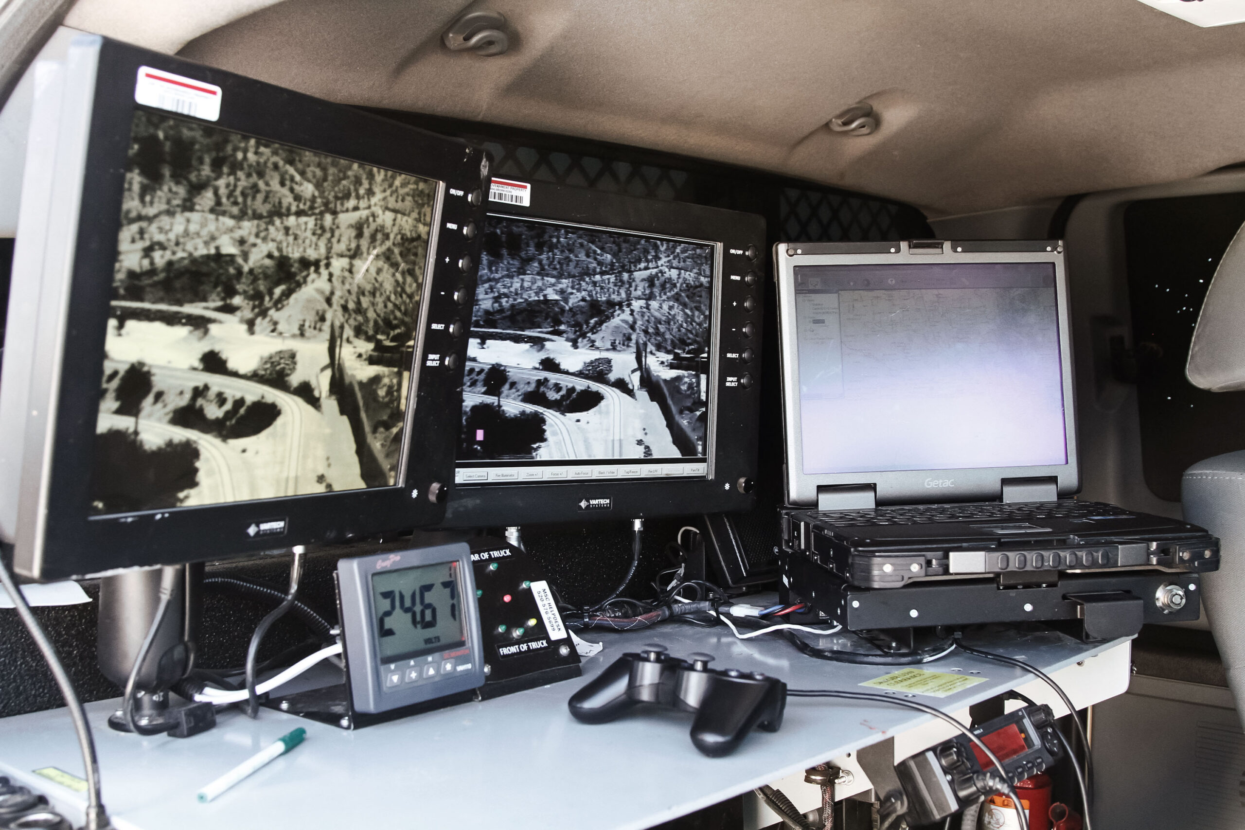 Monitors inside the cab of a Border Patrol truck shows a portion of the U.S.-Mexico border in Sunland Park, N.M., Thursday, June 6, 2019.